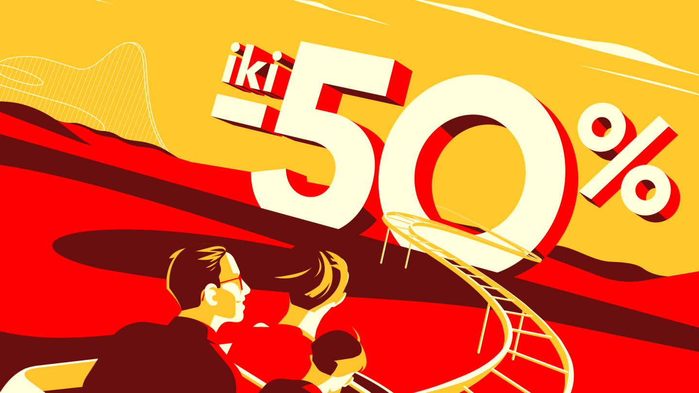 Bold -50% discount sign towering over a desert rollercoaster track, with a family racing toward it — part of JAMAM23 visuals.